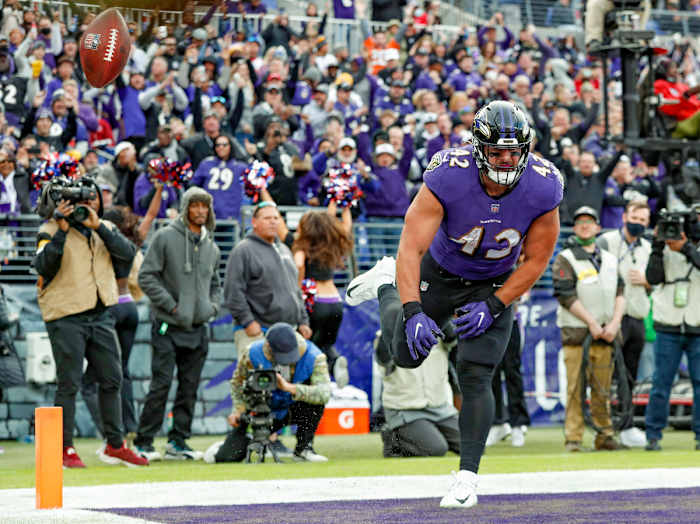 Pat Ricard spikes the ball in celebration of a touchdown in 2021